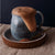 Ceramic mug with overflowing hot chocolate